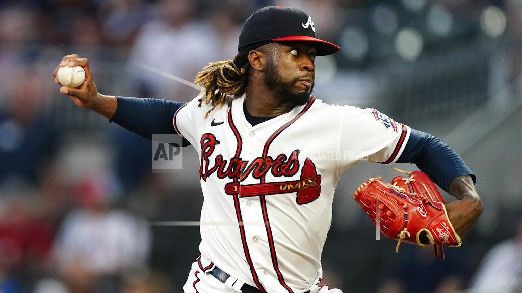 John Bazemore Atlanta Braves starting pitcher Touki Toussaint (62) works against the Colorado Rockies in the first inning of a baseball game Tuesday, Sept. 14, 2021, in Atlanta. (AP Photo/John Bazemore)