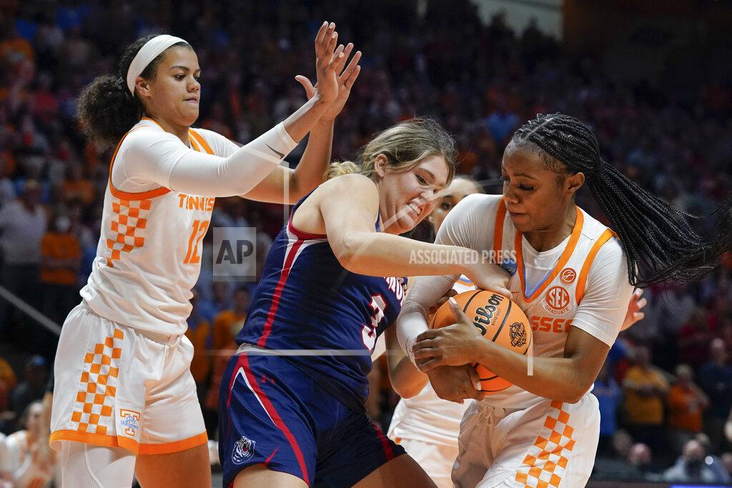 Mark Humphrey Belmont's Madison Bartley (3) battles for the ball with Tennessee's Rae Burrell (12) and Jordan Walker, right, in the second half of a women's college basketball game in the second round of the NCAA tournament Monday, March 21, 2022, in Knoxville, Tenn. (AP Photo/Mark Humphrey)