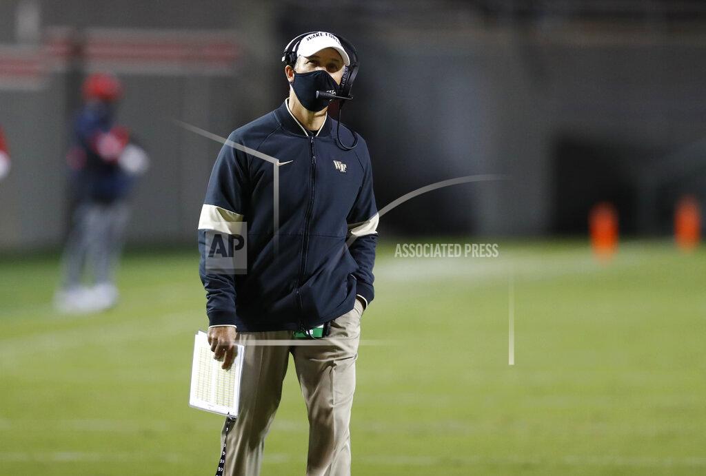 Ethan Hyman Wake Forest coach Dave Clawson looks at the scoreboard during a timeout in the second half of the team's NCAA college football game against North Carolina State in Raleigh, N.C, Saturday, Sept. 19, 2020. (Ethan Hyman/The News & Observer via AP)