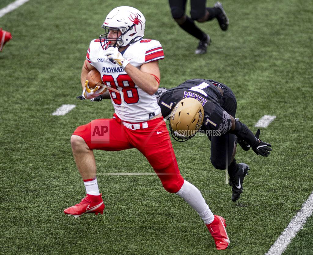 Daniel Lin Richmond tight end John Fitzgerald (88) evades James Madison linebacker Kelvin Azanama (7) during the first half of an NCAA college football game in Harrisonburg, Va., Saturday, April 17, 2021. (Daniel Lin/Daily News-Record Via AP)