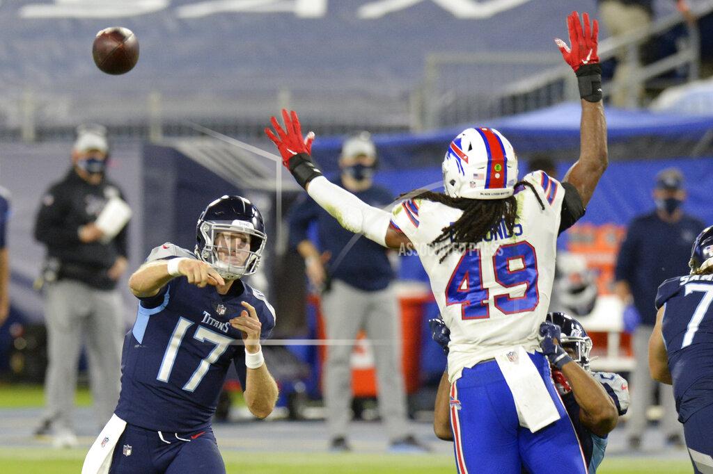 Mark Zaleski Tennessee Titans quarterback Ryan Tannehill (17) passes as he is pressured by Buffalo Bills middle linebacker Tremaine Edmunds (49) in the first half of an NFL football game Tuesday, Oct. 13, 2020, in Nashville, Tenn. (AP Photo/Mark Zaleski)