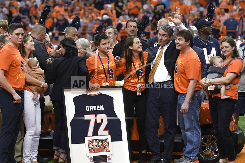 Steve Jacobs Former Syracuse and NFL football player Tim Green waves as his number is retired during the NCAA college football game between Syracuse and Clemson, Saturday, Sept. 14, 2019, in Syracuse, N.Y. (AP Photo/Steve Jacobs)
