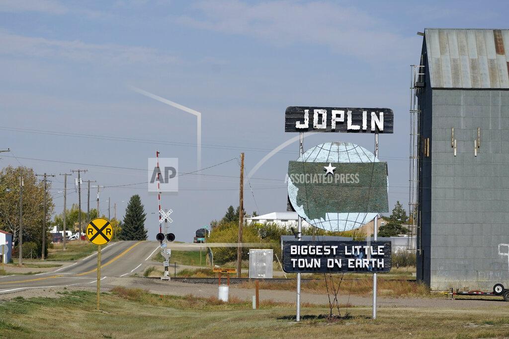 Ted S. Warren A welcome sign for the town of Joplin, Mont., is shown Monday, Sept. 27, 2021. An Amtrak train derailed Saturday near the town, killing three people and injuring others. Federal investigators are seeking the cause of the derailment. (AP Photo/Ted S. Warren)