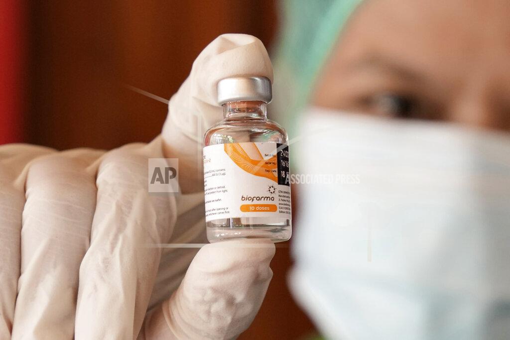 Dita Alangkara A health worker shows a vial of the Sinovac COVID-19 vaccine manufactured by the Indonesian pharmaceutical company Biofarma, during a mass vaccination in Jakarta, Indonesia, Monday, June 21, 2021. Indonesia's president ordered authorities to speed up the country's vaccination campaign as the World Health Organization warned of the need to increase social restrictions in the country amid a fresh surge of coronavirus infections caused by worrisome variants. (AP Photo/Dita Alangkara)