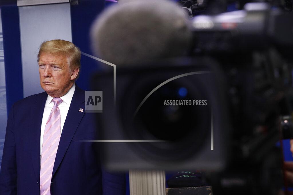 Patrick Semansky FILE - In this April 4, 2020, file photo President Donald Trump listens during a coronavirus task force briefing at the White House, Saturday, April 4, 2020, in Washington. Trump has called on Congress to revive the tax deduction for business-related expenses on meals and entertainment, arguing it would help bolster high-end restaurants hammered by the outbreak. (AP Photo/Patrick Semansky, File)