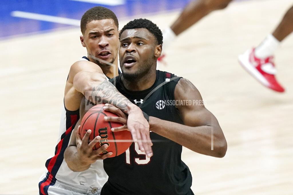 Mark Humphrey South Carolina's Wildens Leveque (15) battles for a rebound with Mississippi's KJ Buffen, left, in the first half of an NCAA college basketball game in the Southeastern Conference Tournament Thursday, March 11, 2021, in Nashville, Tenn. (AP Photo/Mark Humphrey)