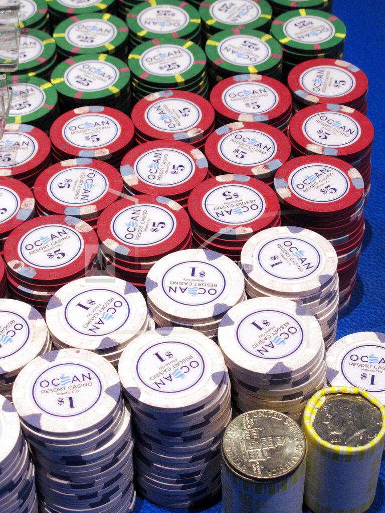 Wayne Parry In this June 18, 2019 photo, gambling chips sit on a a gaming table at the Ocean Casino Resort in Atlantic City, N.J. How to keep chips clean is one of many issues with which U.S. casinos are grappling as they prepare to reopen after shutdowns due to the coronavirus outbreak. (AP Photo/Wayne Parry)