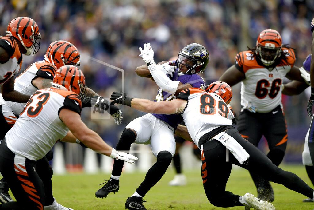 Gail Burton Cincinnati Bengals tight end Drew Sample (89) makes a tackle on Baltimore Ravens cornerback Marlon Humphrey (44) after he intercepted a pass from Bengals quarterback Andy Dalton, not visible, during the first half of a NFL football game Sunday, Oct. 13, 2019, in Baltimore. (AP Photo/Gail Burton)