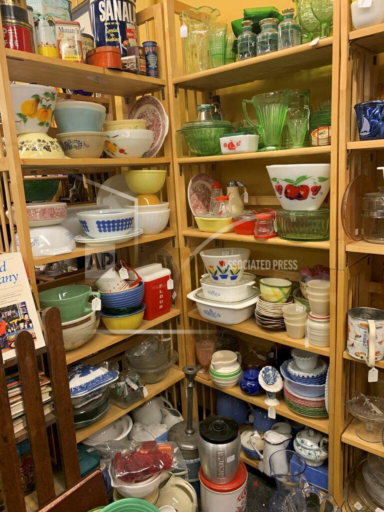 Tracee Herbaugh This image provided by Tracee Herbaugh exhibits some of the vintage kitchenware available at a Waltham, Massachusetts antique shop. Television and social media have also generated interest. Series like "WandaVision," "Firefly Lane," "The Marvelous Mrs. Maisel" and "Mad Men" all highlight midcentury kitchens and kitchenware. (Tracee Herbaugh via AP)