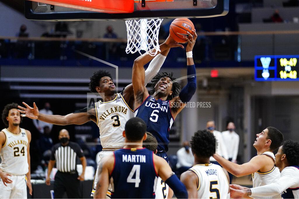 Matt Slocum Connecticut's Isaiah Whaley (5) and Villanova's Brandon Slater (3) leap for a rebound during the second half of an NCAA college basketball game, Saturday, Feb. 20, 2021, in Villanova, Pa. (AP Photo/Matt Slocum)
