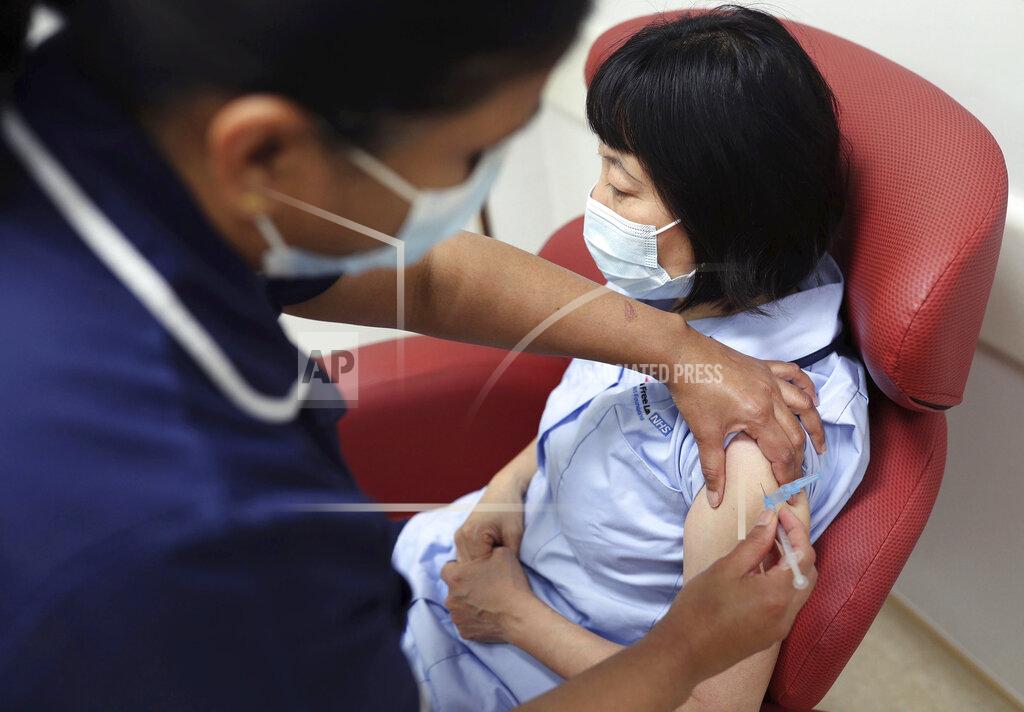 Nurses at the Royal Free Hospital, London, simulate the administration of the Pfizer vaccine to support staff training ahead of the rollout, in London, Friday Dec. 4, 2020. (Yui Mok/Pool Photo via AP)