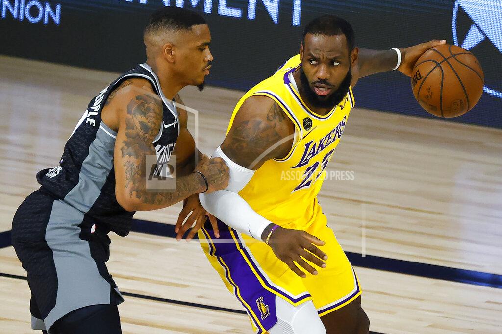 Kevin C. Cox Sacramento Kings' DaQuan Jeffries, left, defends against Los Angeles Lakers' LeBron James during the second quarter of an NBA basketball game Thursday, Aug. 13, 2020, in Lake Buena Vista, Fla. (Kevin C. Cox/Pool Photo via AP)