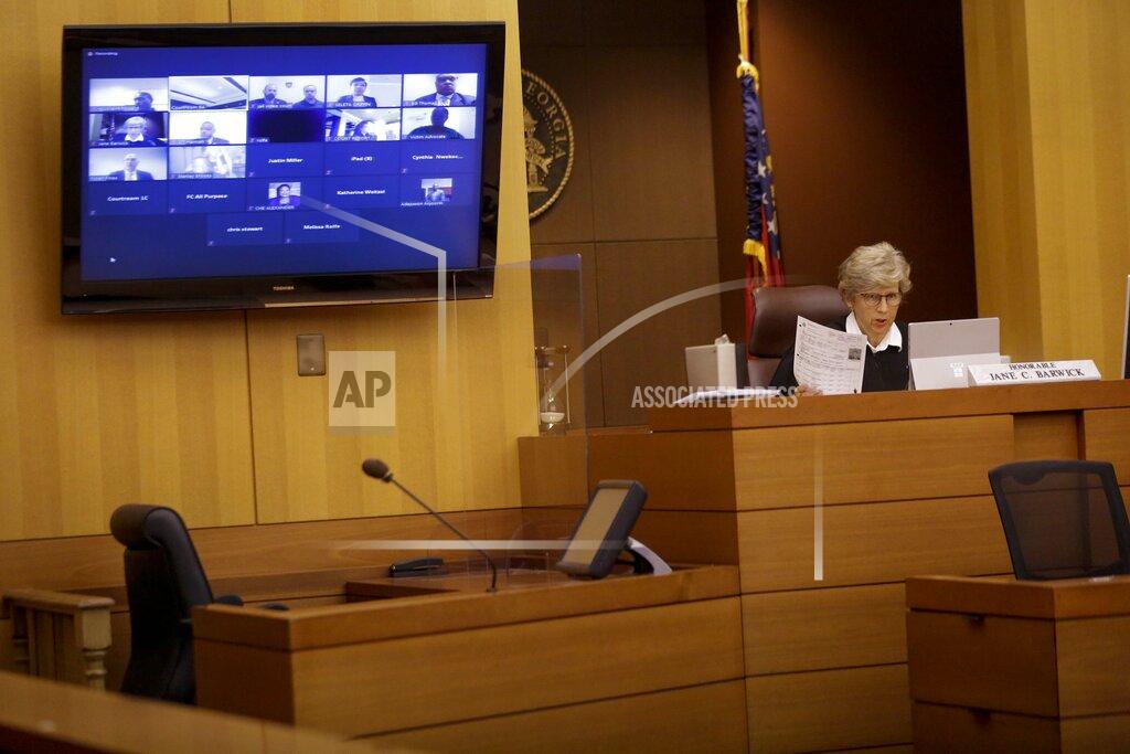 Brynn Anderson Judge Jane C. Barwick speaks during a bond hearing for former Atlanta police officer Garrett Rolfe who appears on a television screen on Tuesday, June 30, 2020, in Atlanta. Rolfe, who fatally shot Rayshard Brooks can be free on bond while his case is pending. A judge set a bond of $500,000 for Rolfe, who faces charges including felony murder in the killing of the 27-year-old Black man. Rolfe fatally shot Brooks in the back when Brooks fired a Taser in his direction while running away after a struggle on June 12. (AP Photo/Brynn Anderson, Pool)