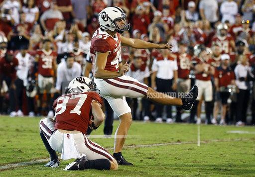 Oklahoma place kicker Gabe Brkic (47) watches as his game winning field goal against West Virginia goes through the goal post during the second half of an NCAA college football game in Norman, Okla., Saturday, Sep. 25, 2021. (AP Photo/Alonzo Adams)