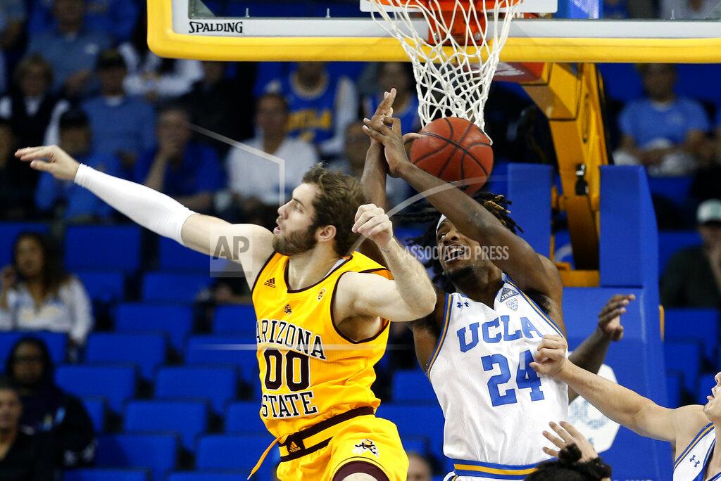 Ringo H.w. Chiu Arizona State forward Mickey Mitchell (00) and UCLA forward Jalen Hill (24) vie for a rebound during the first half of an NCAA college basketball game Thursday, Feb. 27, 2020, in Los Angeles. (AP Photo/Ringo H.W. Chiu)