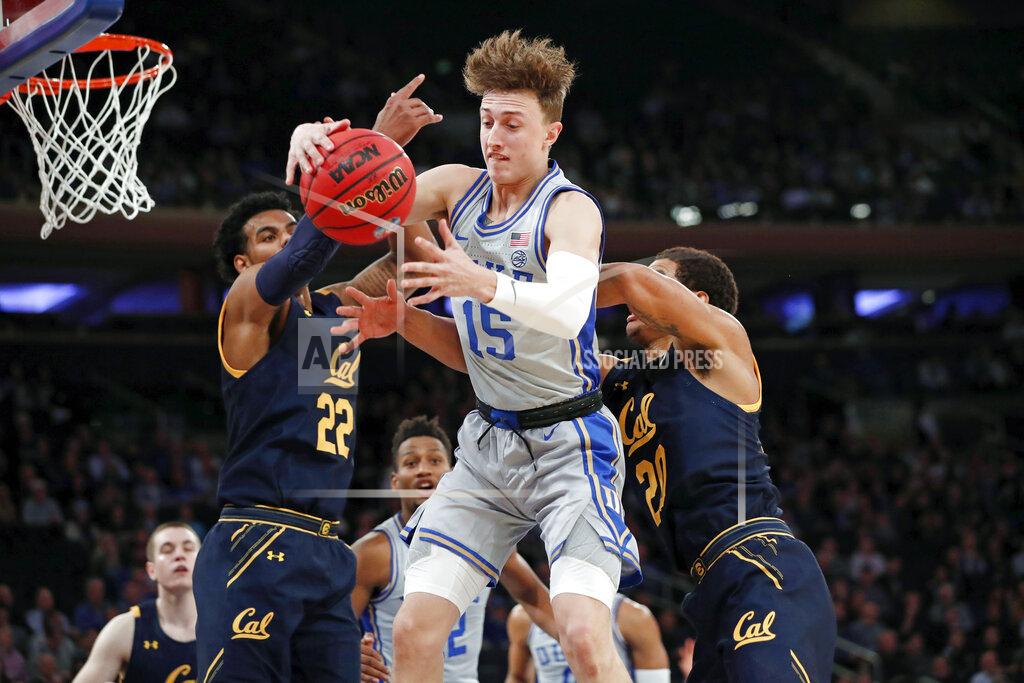 Kathy Willens Duke guard Alex O'Connell (15) grabs the ball in front of California forward Andre Kelly (22) and California guard Matt Bradley (20) during the first half of the first round of the 2K Empire Classic NCAA college basketball tournament, Thursday, Nov. 21, 2019, in New York. (AP Photo/Kathy Willens)
