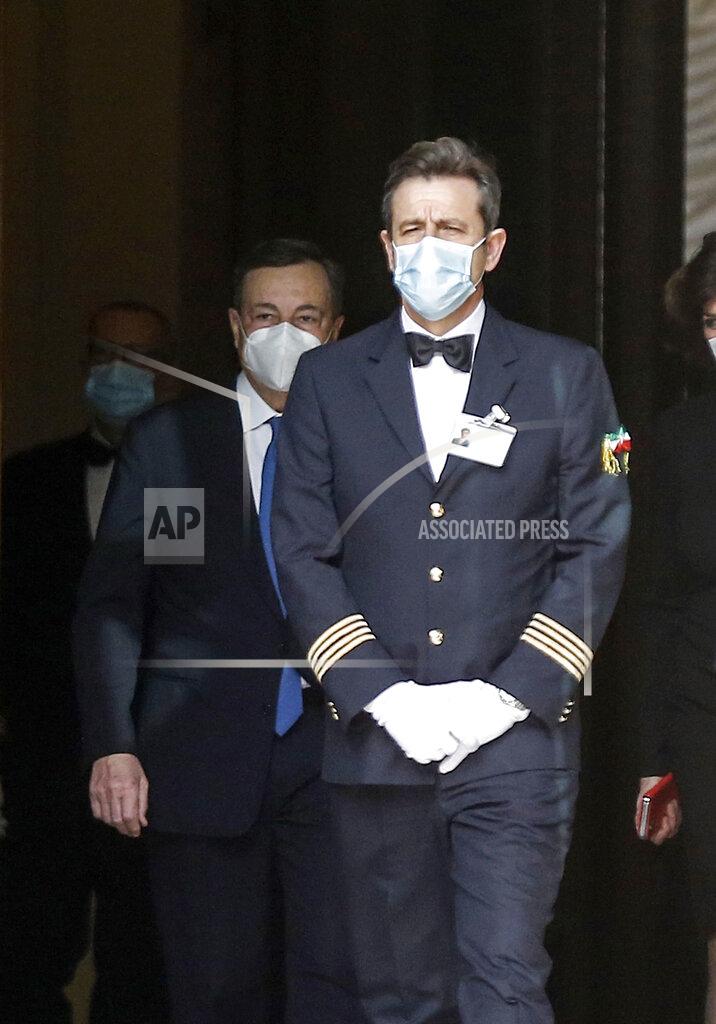 Cecilia Fabiano Former European Central Bank President Mario Draghi, left, leaves the Chamber of Deputies following talks, in Rome, Wednesday, Feb. 3, 3021. Mario Draghi has agreed to try to form a non-political government to steer Italy through the coronavirus pandemic. (Cecilia Fabiano/LaPresse via AP)