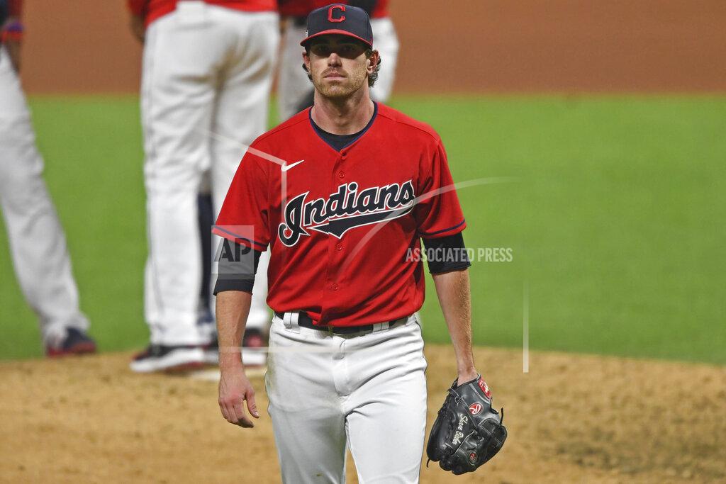 David Dermer Cleveland Indians starting pitcher Shane Bieber (57) walks to the dugout after being removed from the game in the fifth inning of Game 1 of an American League wild-card baseball series against the New York Yankees, Tuesday, Sept. 29, 2020, in Cleveland. (AP Photo/David Dermer)