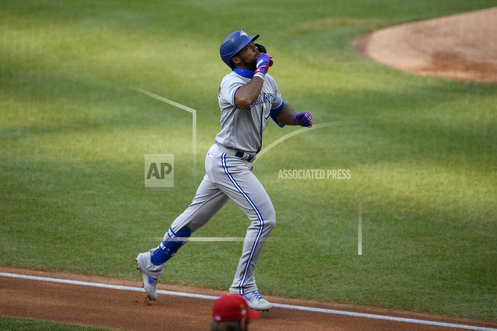 Nick Wass Toronto Blue Jays' Teoscar Hernandez reacts as he heads home while circling the bases after his home run during the first inning of a baseball game against the Washington Nationals, Monday, July 27, 2020, in Washington. (AP Photo/Nick Wass)