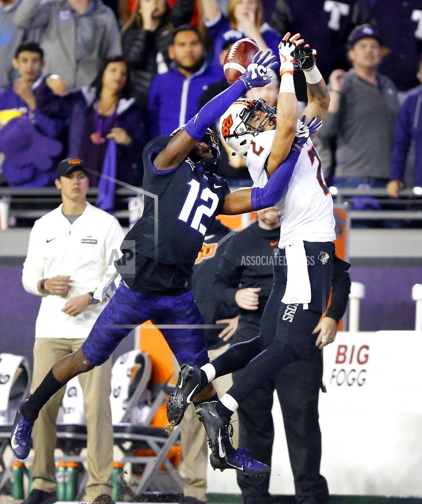 Tom Fox TCU cornerback Jeff Gladney (12) keeps Oklahoma State wide receiver Tylan Wallace (2) from catching a second-half pass during an NCAA college football game Saturday, Nov. 24, 2018, in Fort Worth, Texas. TCU won 31-24. (Tom Fox/The Dallas Morning News via AP)