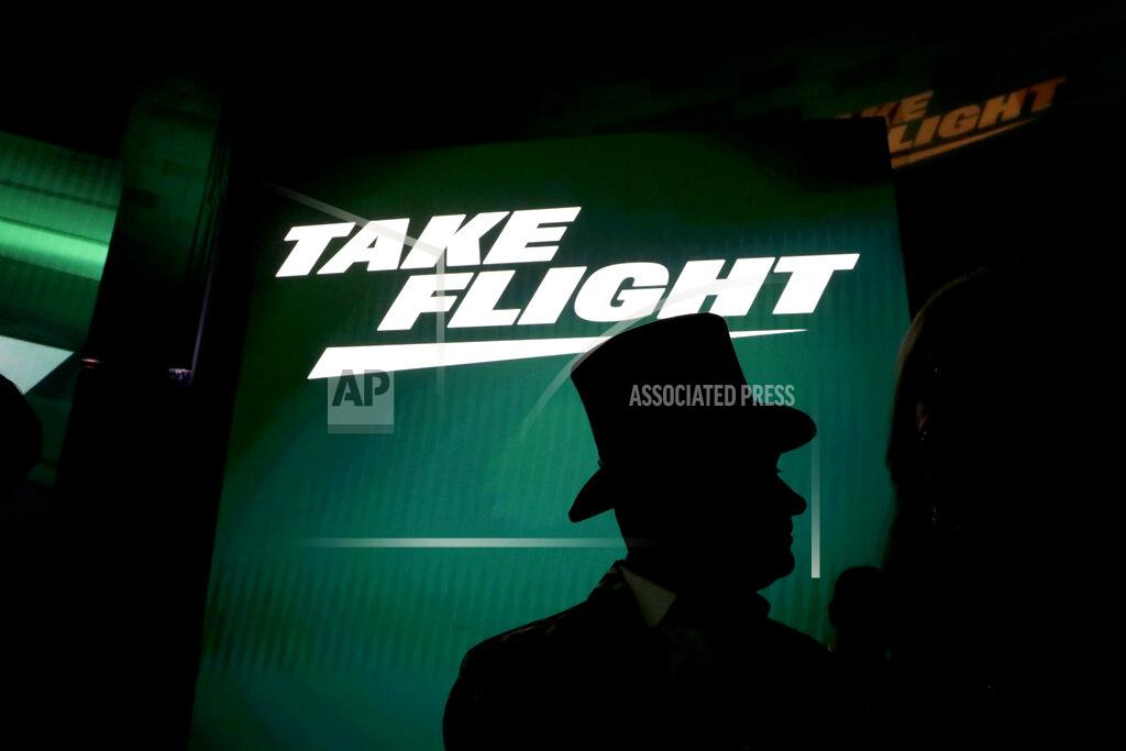 Julio Cortez A fan wears a top hat waits for an event unveiling the New York Jets' new NFL football uniforms Thursday, April 4, 2019, in New York. (AP Photo/Julio Cortez)