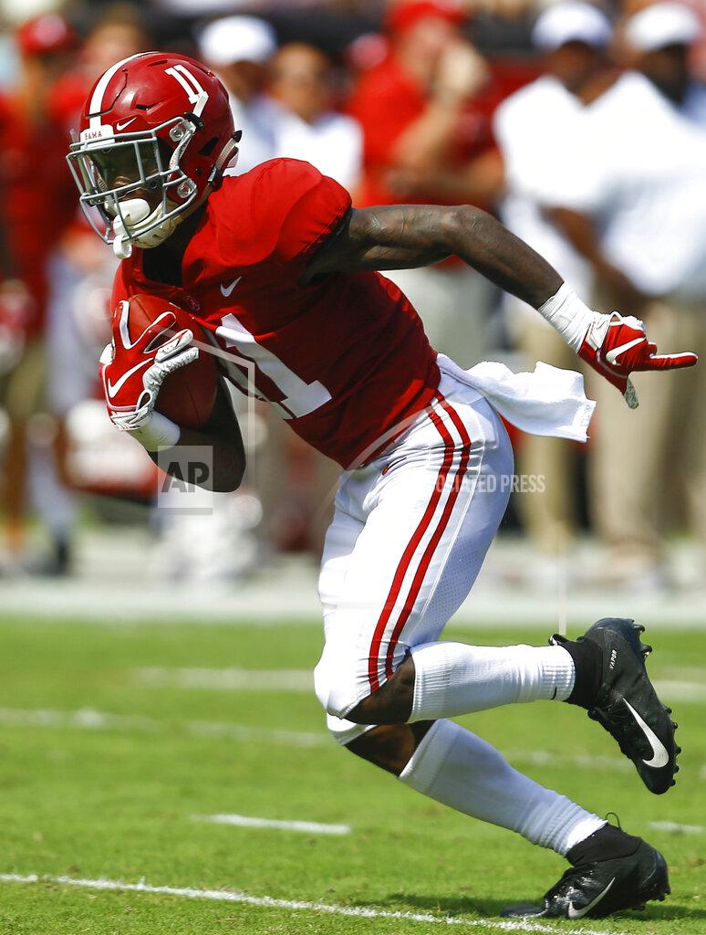 Butch Dill FILE - In this Sept. 29, 2018, file photo, Alabama wide receiver Henry Ruggs III (11) catches a pass and scores a touchdown during the first half of an NCAA college football game against Louisiana-Lafayette, in Tuscaloosa, Ala. No. 1 Alabama has one of the SEC's most talented collection of receivers, and the Crimson Tide is spreading it around among Jerry Jeudy, Henry Ruggs III, DeVonta Smith and Jaylen Waddle. (AP Photo/Butch Dill, File)