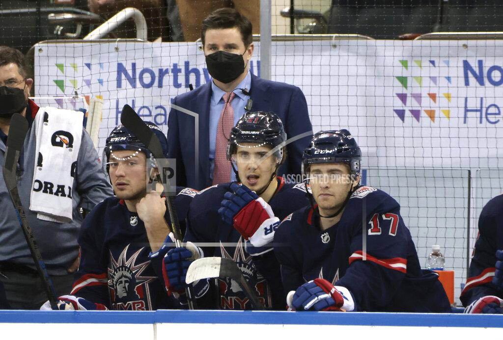 Bruce Bennett FILE - In this Wednesday, March 17, 2021 file photo, New York Rangers Associate General Manager Chris Drury works the bench during an NHL hockey game against the Philadelphia Flyers in New York. The New York Rangers abruptly fired president John Davidson and general manager Jeff Gorton on Wednesday, May 5, 2021 with three games left in the season. Chris Drury was named president and GM. He previously served as associate GM under Davidson and Gorton. (Bruce Bennett/Pool Photo via AP, File)