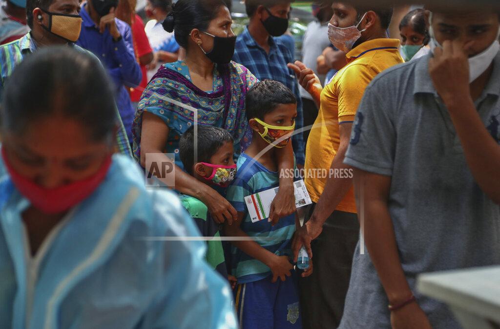 Mahesh Kumar A FILE - In this April 25, 2021, file photo, people wearing masks as a precaution against the coronavirus wait to test for COVID-19 at a government hospital in Hyderabad, India. The World Health Organization said Monday, May 10, that a worrisome variant was first detected in India may spread more easily. Scientists are still trying to figure out if it resulted in the terrifying surge of infections in the nation, and looking to see if this could this happen elsewhere. (AP Photo/Mahesh Kumar A.)