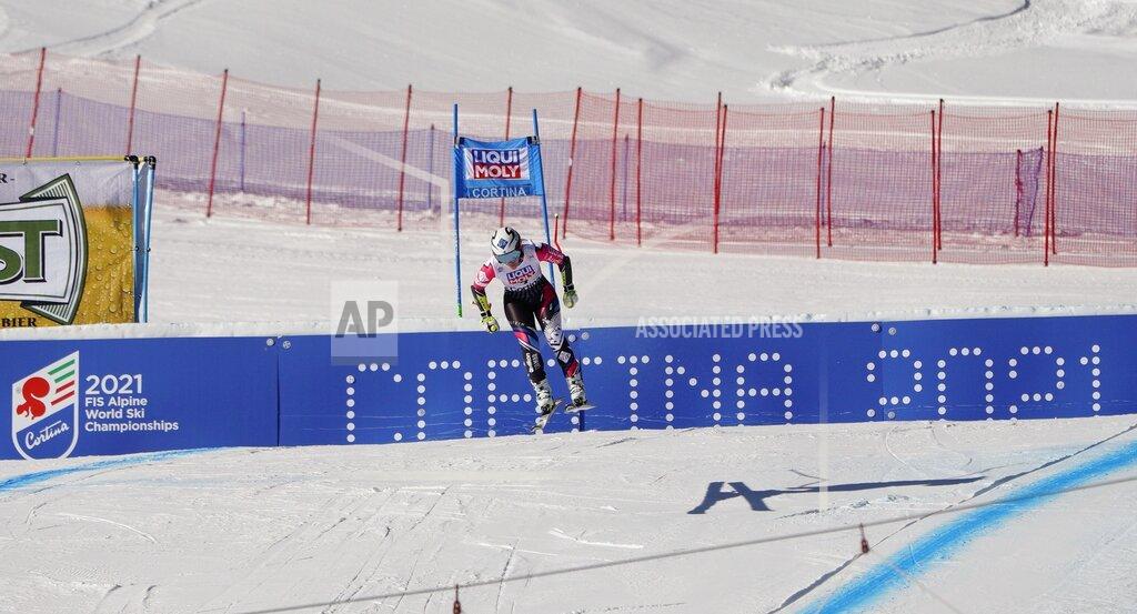 Giovanni Auletta FILE - In this Jan. 20, 2019 file photo, Liechtenstein's Tina Weirather speeds down the course as a banner advertising the ski world championships in Cortina d'Ampezzo is seen in background, during an alpine ski, women's World Cup super-G in Cortina D'Ampezzo, Italy. The natural beauty of Cortina will be of special importance at the alpine ski World championships, with organizers hoping that the images from the slopes beamed around the globe to TV viewers will make up for the lack of fans amid the coronavirus pandemic. (AP Photo/Giovanni Auletta, File)