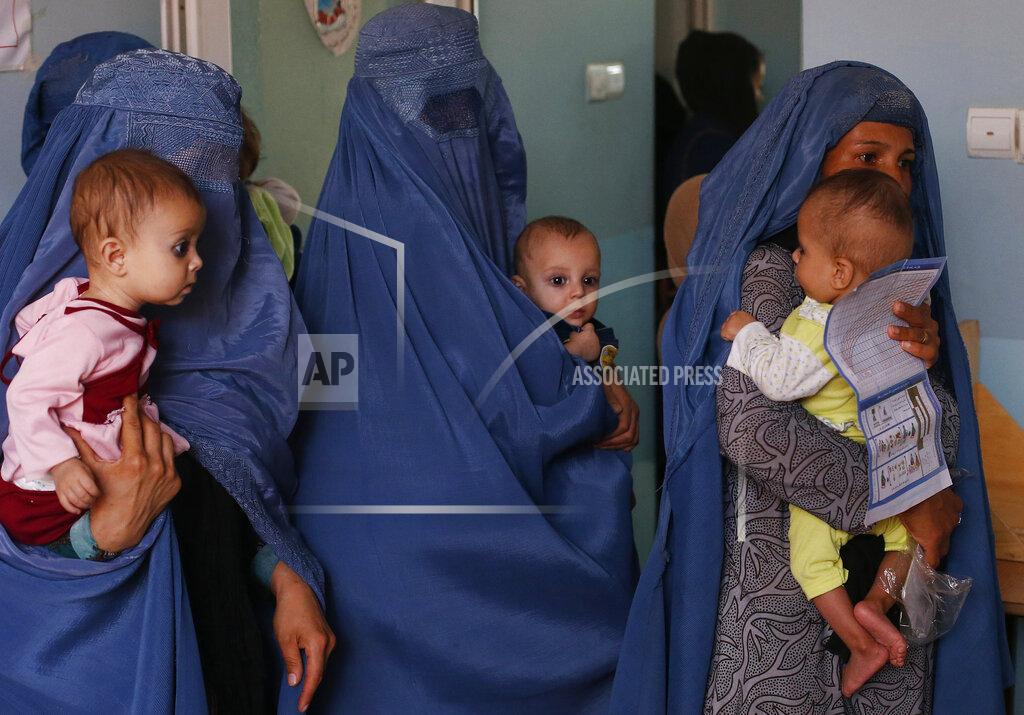 Rafiq Maqbool FILE - In this Aug. 26, 2019 photo, mothers hold their babies suffering from malnutrition as they wait at a UNICEF clinic in Jabal Saraj, north of Kabul, Afghanistan. In Afghanistan, severe childhood malnutrition spiked from 690,000 in January 2020 to 780,000 — a 13% increase, according to UNICEF. Food prices have risen by more than 15%, according to the World Food Program. (AP Photo/Rafiq Maqbool)