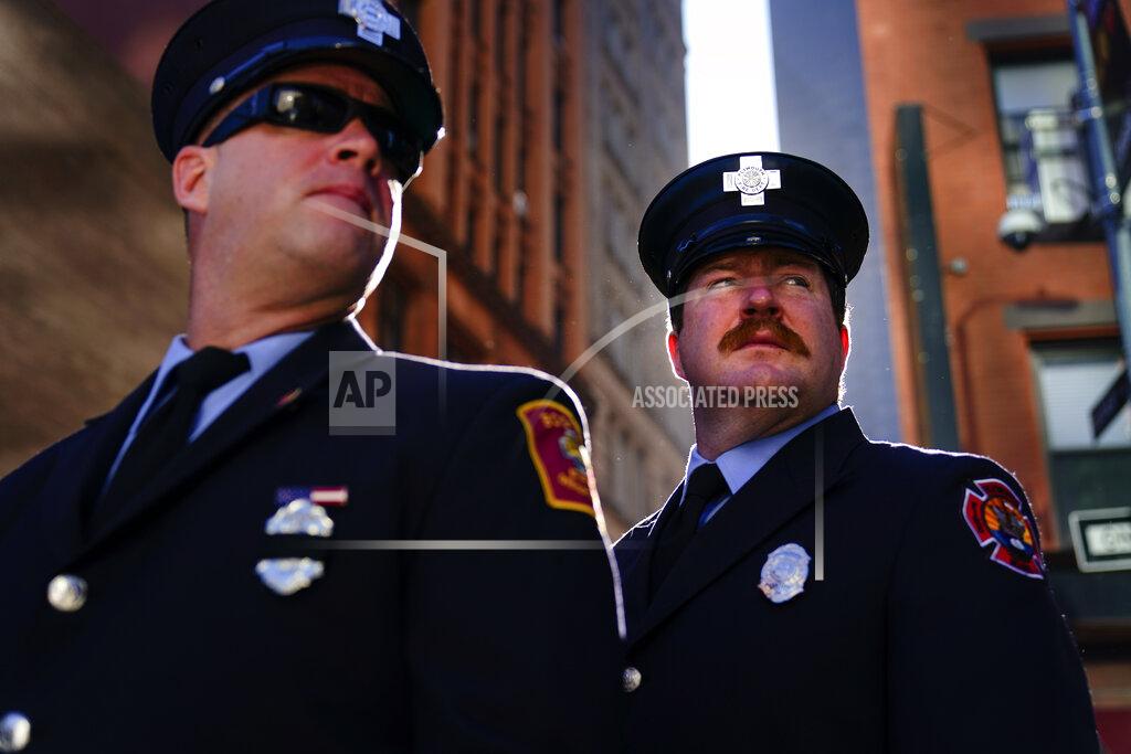 Matt Rourke Firefighters from Massachusetts gather with others outside the National September 11 Memorial and Museum during a ceremony marking the 20th anniversary of the 9/11 terrorist attacks, Saturday, Sept. 11, 2021, in New York. (AP Photo/Matt Rourke)