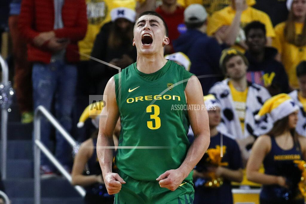 Paul Sancya Oregon guard Payton Pritchard celebrates a basket against Michigan during the overtime of an NCAA college basketball game in Ann Arbor, Mich., Saturday, Dec. 14, 2019. Oregon won 71-70 in overtime. (AP Photo/Paul Sancya)