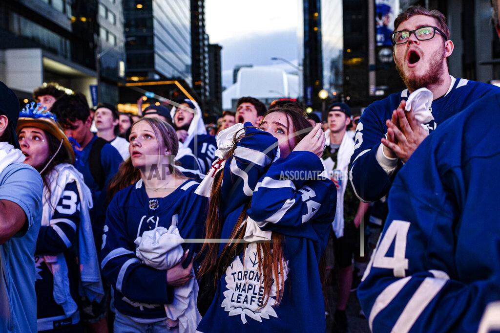 Christopher Katsarov Fans react during Game 7 of an NHL hockey first-round playoff series between the Toronto Maple Leafs and the Tampa Bay Lightning in Toronto, Saturday May 14, 2022. (Christopher Katsarov/The Canadian Press via AP)