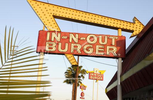 In-N-Out Burger signs fill the skyline on Tuesday, June 8, 2010, in Calif. The In-N-Out hamburger chain is sizzling mad after San Francisco shut down its indoor dining for refusing to check customers’ vaccination status. The company's Fisherman’s Wharf location — its only one in San Francisco — was temporarily shut by the Department of Public Health on Oct. 14. (AP Photo/Adam Lau)