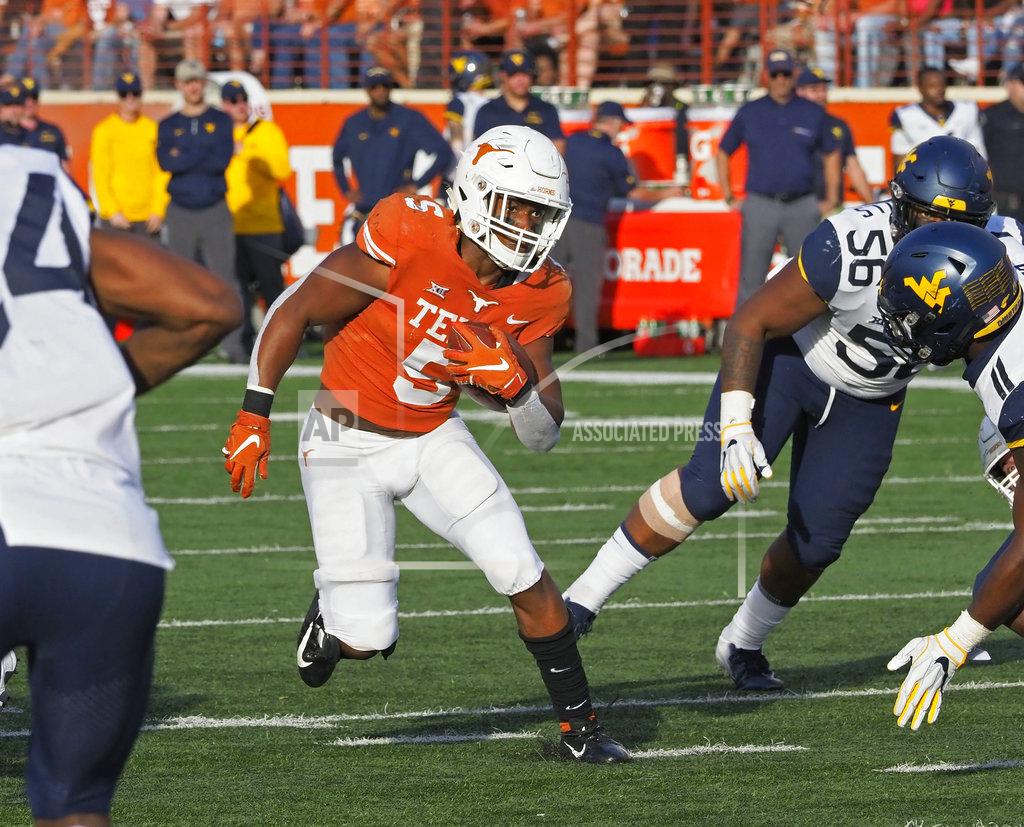 Michael Thomas Texas running back Tre Watson (5) runs the ball during the second half of an NCAA college football game against West Virginia, Saturday, Nov. 3, 2018, in Austin, Texas. West Virginia won 42-41. (AP Photo/Michael Thomas)