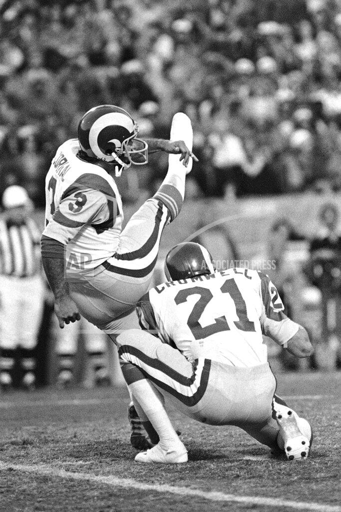 Uncredited FILE - In this Jan. 7, 1980, file photo, Frank Corral (3) of the Los Angeles Rams, kicks his third and final field goal against the Tampa Bay Buccaneers in the NFC Championship NFL football game in Tampa, Fla. Holding is Nolan Cromwell (21). Los Angeles beat Tampa 9-0 on three field goals. (AP Photo/File)
