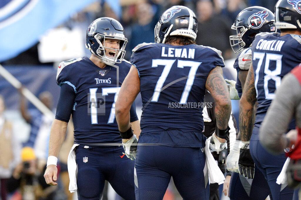 Mark Zaleski Tennessee Titans quarterback Ryan Tannehill (17) celebrates with offensive tackle Taylor Lewan (77) after Tannehill scored a touchdown on a 21-yard run against the Jacksonville Jaguars in the first half of an NFL football game Sunday, Nov. 24, 2019, in Nashville, Tenn. (AP Photo/Mark Zaleski)
