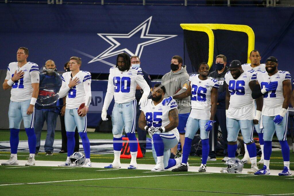 Michael Ainsworth The Dallas Cowboys line the sideline during the playing of the national anthem before the first half of an NFL football game against the Arizona Cardinals in Arlington, Texas, Monday, Oct. 19, 2020. (AP Photo/Michael Ainsworth)