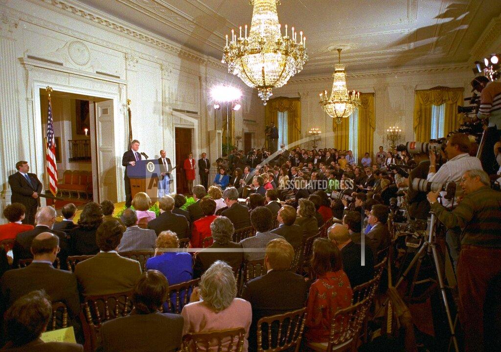 Marcy Nighswander FILE - In this March 23, 1993, file photo, members of the media fill the East Room of the White House during President Bill Clinton's first formal news conference since taking office. (AP Photo/Marcy Nighswander, File)
