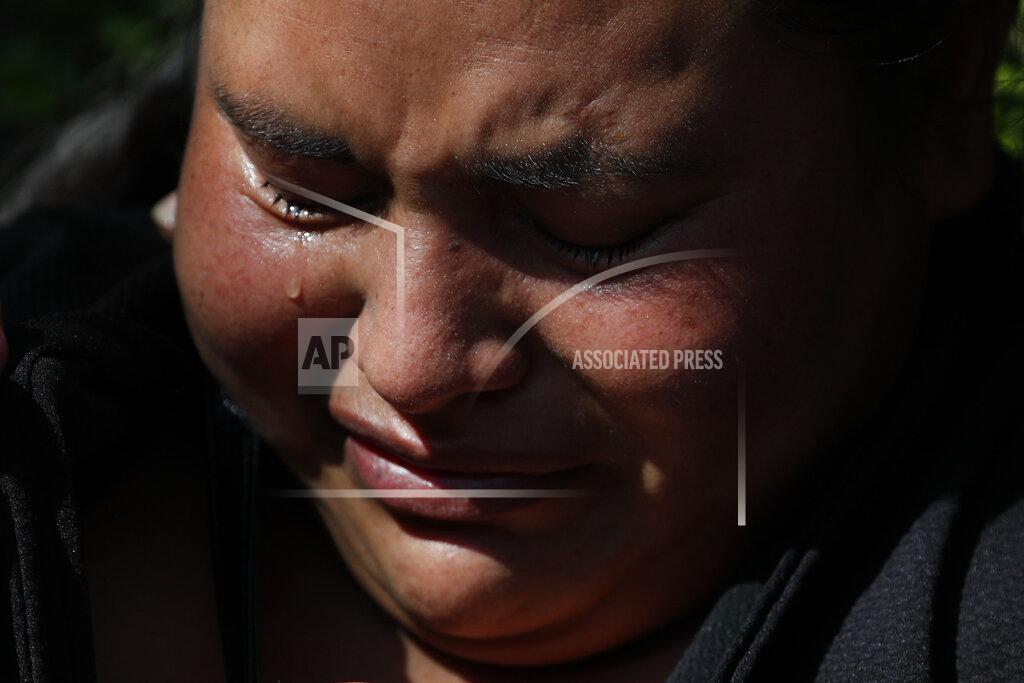 Rebecca Blackwell Gabriela Gomez grieves for her sister Rosa who was killed at the scene where police chief Omar Garcia Harfuch was attacked by gunmen in Mexico City, Friday, June 26, 2020. Heavily armed gunmen attacked and wounded Mexico City's police chief in an operation that left several dead. (AP Photo/Rebecca Blackwell)