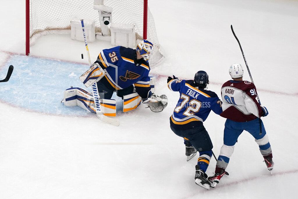 Jeff Roberson Colorado Avalanche's Nazem Kadri, right, scores past St. Louis Blues goaltender Ville Husso (35) and Justin Faulk (72) during the second period in Game 4 of an NHL hockey Stanley Cup second-round playoff series Monday, May 23, 2022, in St. Louis. (AP Photo/Jeff Roberson)