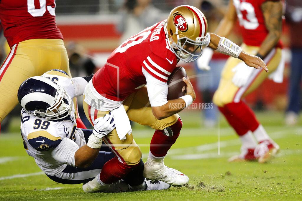 John Hefti Los Angeles Rams defensive tackle Aaron Donald (99) sacks San Francisco 49ers quarterback Jimmy Garoppolo (10) during the second half of an NFL football game in Santa Clara, Calif., Saturday, Dec. 21, 2019. (AP Photo/John Hefti)