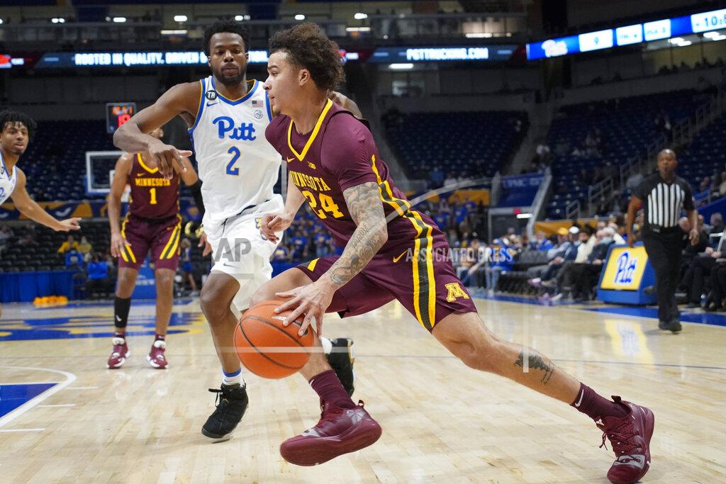 Keith Srakocic Minnesota's Sean Sutherlin (24) drives past Pittsburgh's Femi Odukale (2) during the first half of an NCAA college basketball game Tuesday, Nov. 30, 2021, in Pittsburgh. (AP Photo/Keith Srakocic)