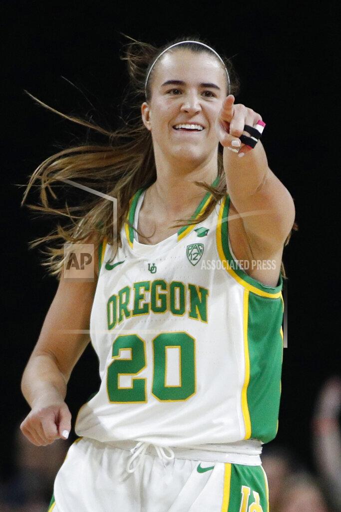 John Locher FILE - In this March 8, 2020, file photo, Oregon's Sabrina Ionescu (20) reacts after her team scored against Stanford during the second half of an NCAA college basketball game in the final of the Pac-12 women's tournament in Las Vegas. Ionescu is among the athletes who will help young girls and women stay mentally and physically fit during the coronavirus pandemic. The Women’s Sports Foundation and Yahoo Sports are launching #WeKeepPlaying, a live-stream event on Saturday at 4 p.m. EDT. (AP Photo/John Locher, File)