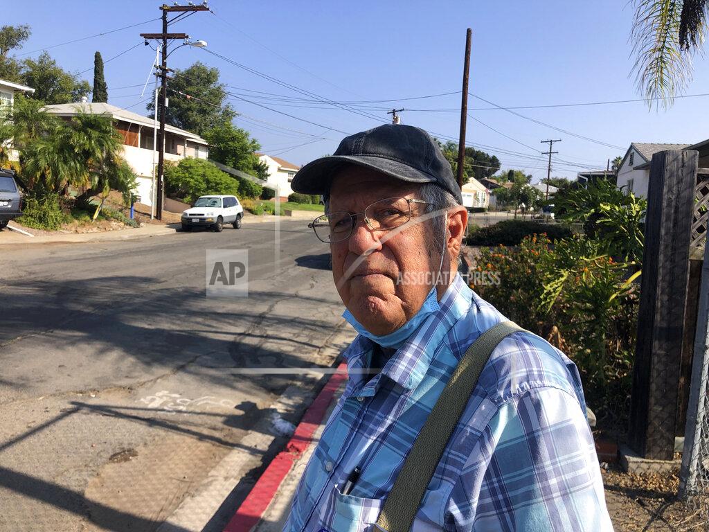 Julie Watson Joe Cusumano, 77, poses for a photo on Tuesday, Sept. 14, 2021, outside a San Diego polling site after casting his ballot in favor of recalling California Gov. Gavin Newsom. Cusumano, a barber, said he wants Newsom to be replaced by conservative radio host Larry Elder who he said is more knowledgeable. (AP Photo by Julie Watson)
