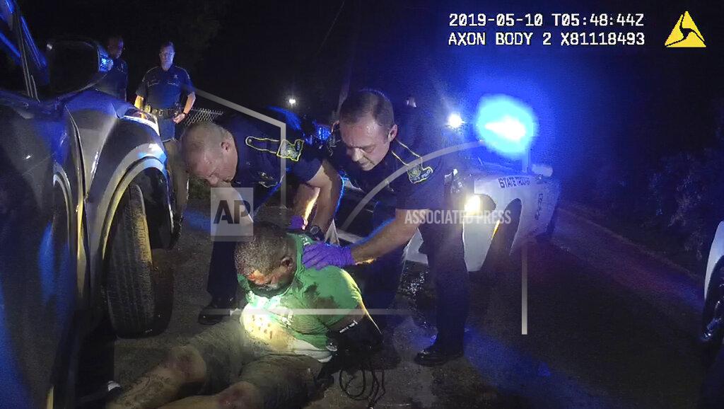 Dakota Demoss FILE - In this image from Louisiana State Police Trooper Dakota DeMoss' body camera video obtained by The Associated Press, fellow troopers hold up Ronald Greene before paramedics arrive on May 10, 2019, outside of Monroe, La. The video obtained by The Associated Press shows Louisiana state troopers stunning, punching and dragging the Black man as he apologizes for leading them on a high-speed chase, footage authorities refused to release in the two years since Greene died in police custody. (Dakota DeMoss/Louisiana State Police via AP)