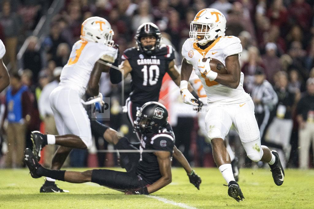 Sean Rayford Tennessee running back Ty Chandler, right, runs with the ball during the first half of an NCAA college football game against South Carolina, Saturday, Oct. 27, 2018, in Columbia, S.C. (AP Photo/Sean Rayford)