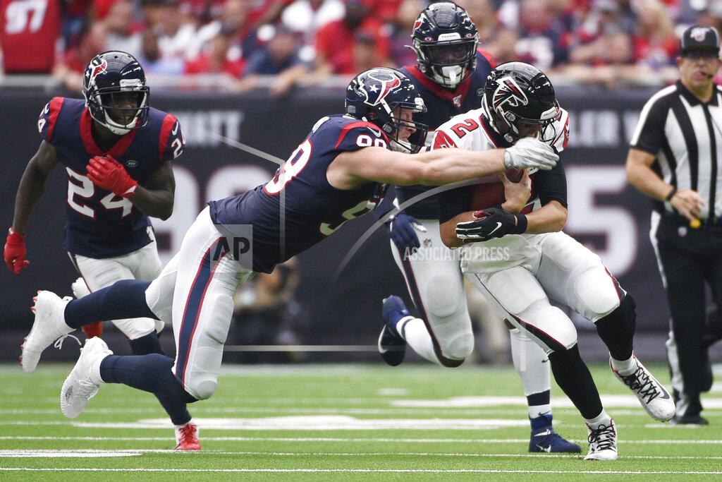 Atlanta Falcons quarterback Matt Ryan (2) is hit by Houston Texans defensive end J.J. Watt (99) during the first half of an NFL football game Sunday, Oct. 6, 2019, in Houston. (AP Photo/Eric Christian Smith)