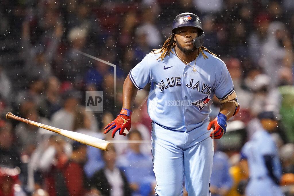 Elise Amendola Toronto Blue Jays' Vladimir Guerrero Jr. tosses his bat after hitting a three-run home run in the fifth inning of the team's baseball game against the Boston Red Sox at Fenway Park, Thursday, July 29, 2021, in Boston. (AP Photo/Elise Amendola)