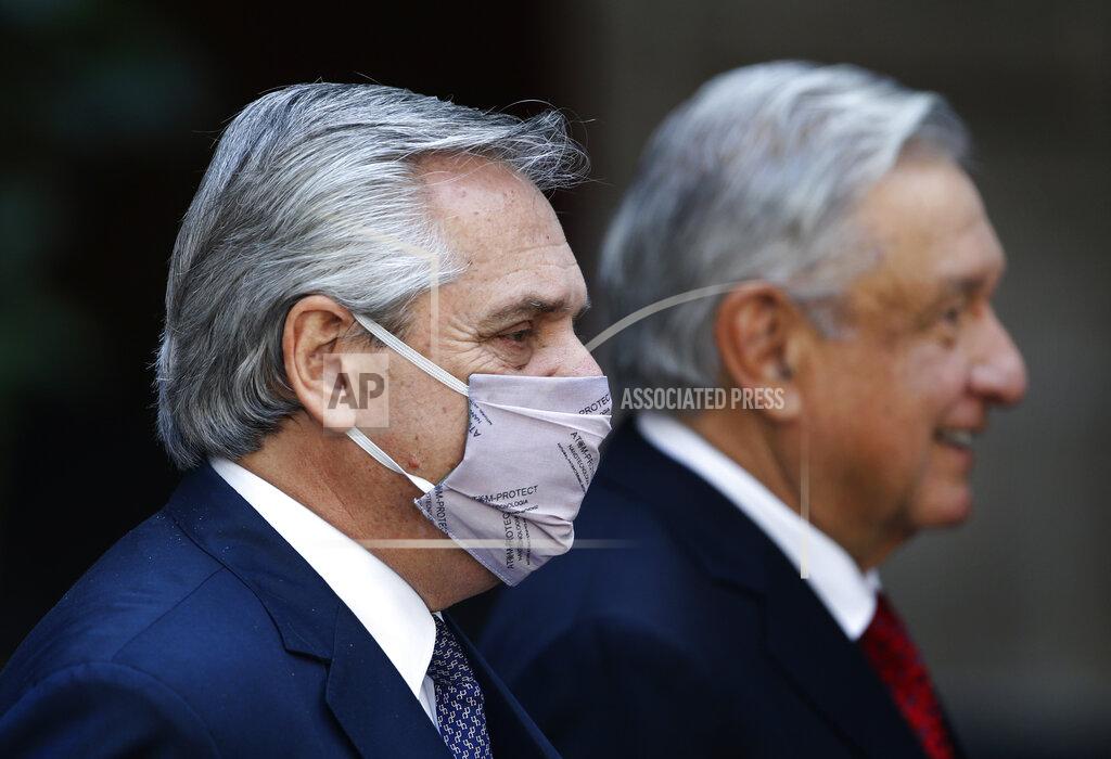 Marco Ugarte Argentina's President Alberto Fernandez attends a ceremony with Mexican President Andres Manuel Lopez Obrador at the National Palace in Mexico City, Tuesday, Feb. 23, 2021, amid the COVID-19 pandemic. Fernandez is on a four-day official visit to Mexico. (AP Photo/Marco Ugarte)
